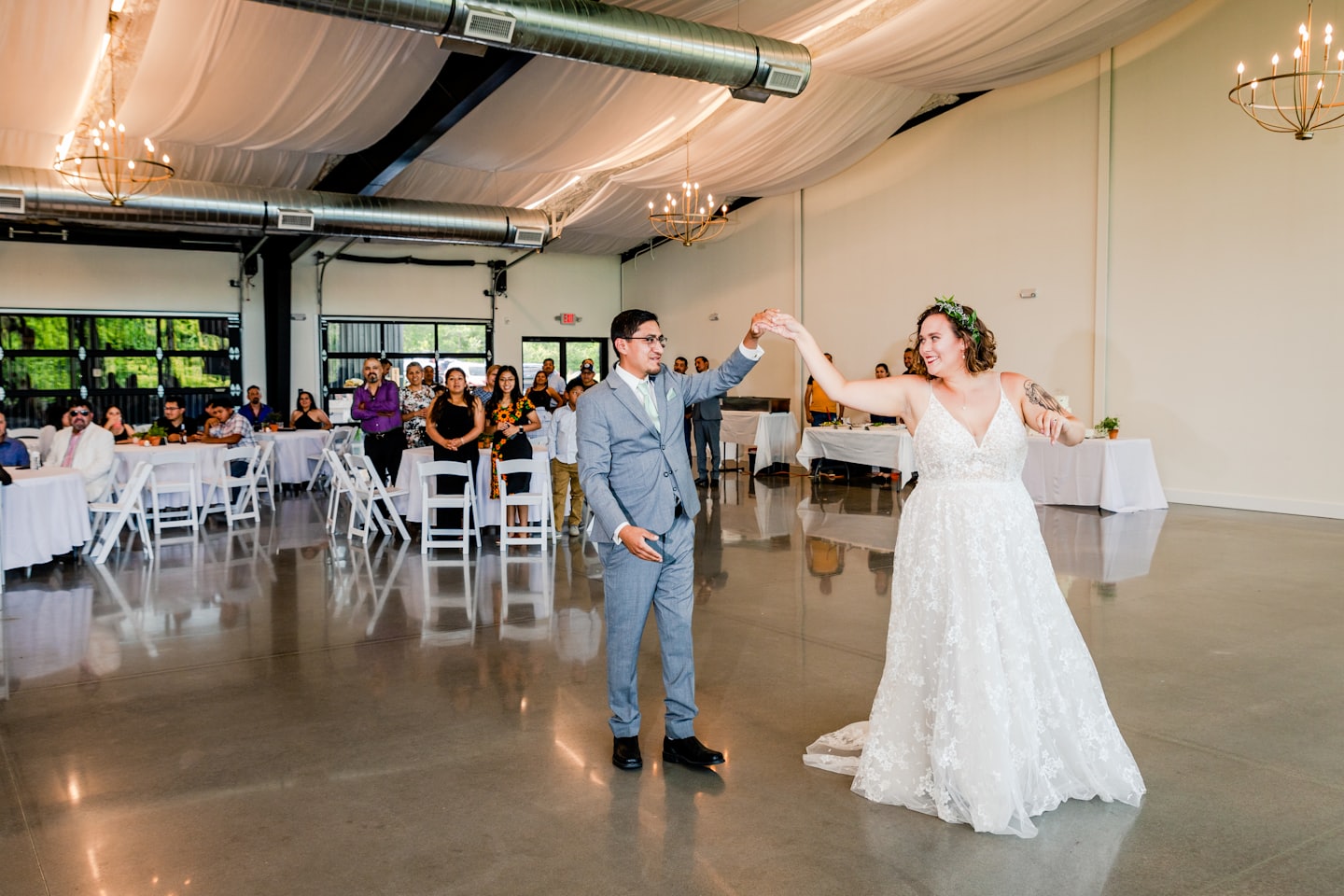 Bride and groom dancing at their wedding reception venue.